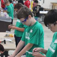 Students construct their wing flaps for their plane